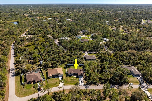 birds eye view of property with a residential view and a forest view