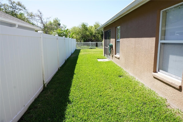 view of yard featuring a fenced backyard