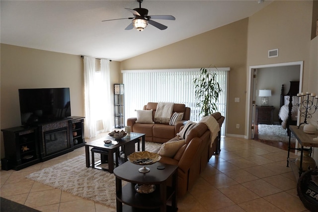 living room featuring high vaulted ceiling, light tile patterned floors, visible vents, and ceiling fan