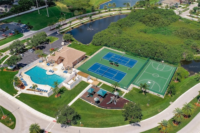 birds eye view of property with a water view