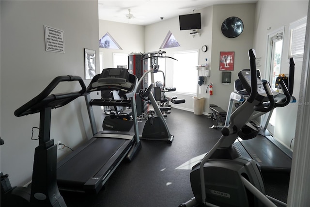 gym with plenty of natural light, baseboards, and ceiling fan