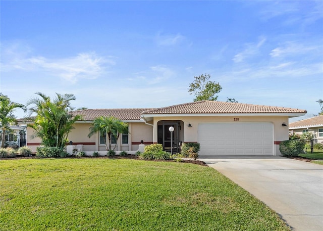 view of front of home featuring a front yard, driveway, an attached garage, stucco siding, and a tile roof