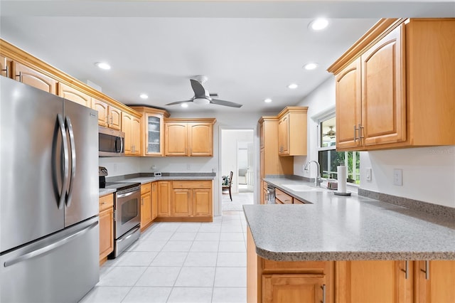 kitchen featuring a sink, recessed lighting, appliances with stainless steel finishes, light tile patterned flooring, and ceiling fan