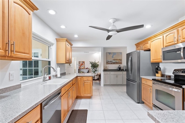 kitchen with recessed lighting, a ceiling fan, appliances with stainless steel finishes, and a sink