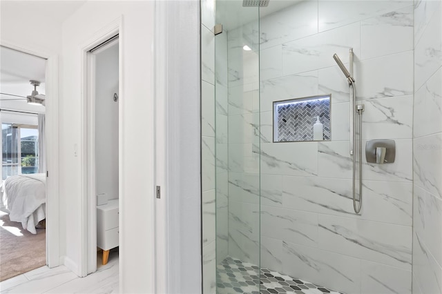 full bathroom featuring a marble finish shower, marble finish floor, ensuite bath, and a ceiling fan