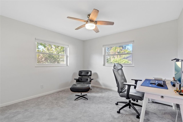 home office with baseboards, carpet, and a ceiling fan