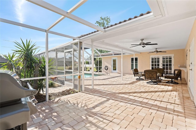 sunroom with ceiling fan