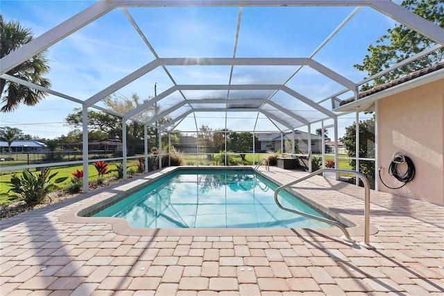 outdoor pool with a patio and a lanai