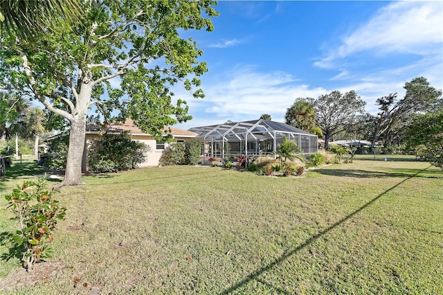 view of yard with glass enclosure