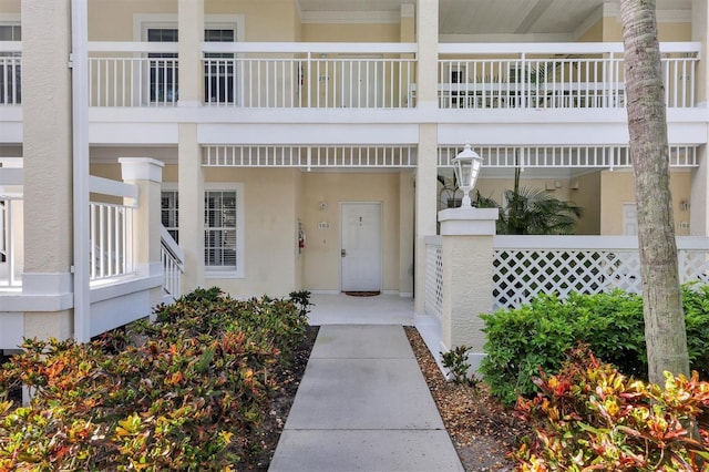 doorway to property with stucco siding