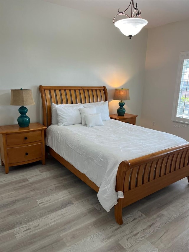 bedroom with light wood finished floors