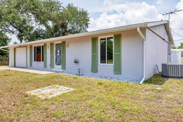 18348 Yale Ave, Port Charlotte, FL 33948 - single story home featuring central AC unit, stucco siding, an attached garage, and a front yard