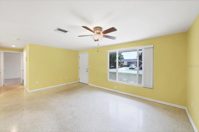 18348 Yale Ave, Port Charlotte, FL 33948 - empty room with baseboards, speckle patterned floor, and a ceiling fan