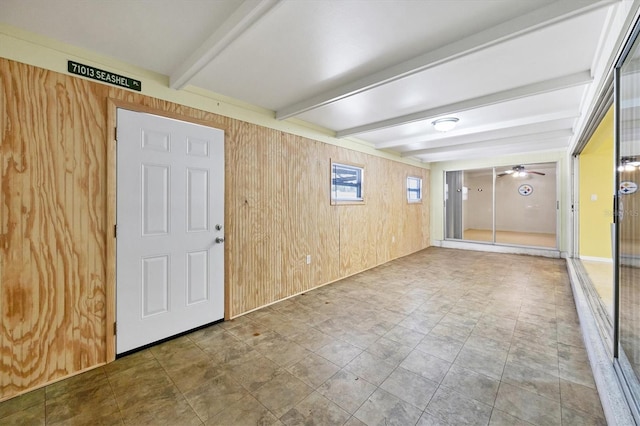 18348 Yale Ave, Port Charlotte, FL 33948 - unfurnished room with beam ceiling, wooden walls, and a ceiling fan
