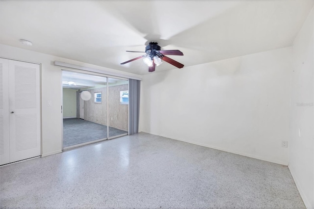 18348 Yale Ave, Port Charlotte, FL 33948 - unfurnished bedroom with speckled floor, baseboards, and ceiling fan