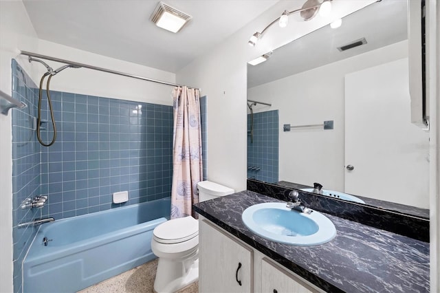 18348 Yale Ave, Port Charlotte, FL 33948 - bathroom featuring toilet, shower / tub combo with curtain, speckled floor, and vanity