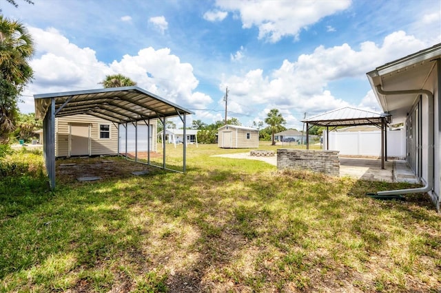 18348 Yale Ave, Port Charlotte, FL 33948 - view of grassy yard featuring a gazebo, an outdoor structure, a carport, and a shed