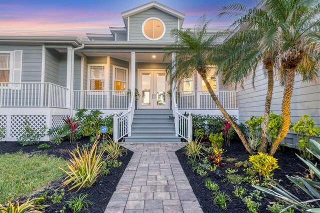 810 Siesta Dr, Sarasota, FL 34242 - property entrance featuring a porch