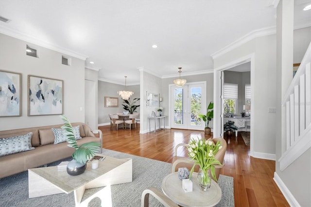 810 Siesta Dr, Sarasota, FL 34242 - living room with wood finished floors, recessed lighting, baseboards, a chandelier, and ornamental molding