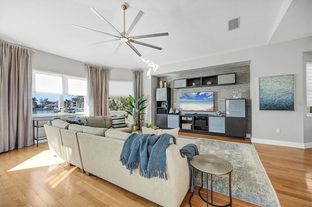 810 Siesta Dr, Sarasota, FL 34242 - living area with ceiling fan, light wood-type flooring, and baseboards