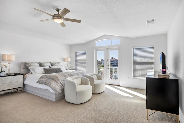 810 Siesta Dr, Sarasota, FL 34242 - carpeted bedroom featuring access to outside, vaulted ceiling, a ceiling fan, and a textured ceiling