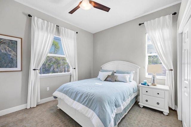 810 Siesta Dr, Sarasota, FL 34242 - bedroom featuring light colored carpet, baseboards, and ceiling fan