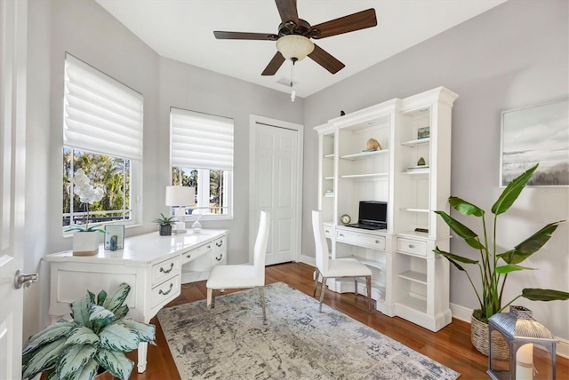 810 Siesta Dr, Sarasota, FL 34242 - office space with a ceiling fan, wood finished floors, and baseboards