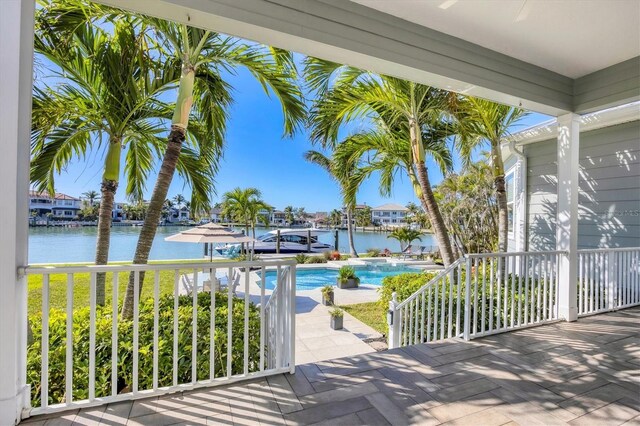810 Siesta Dr, Sarasota, FL 34242 - view of patio with an outdoor pool and a water view
