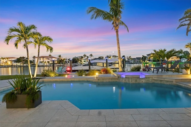 810 Siesta Dr, Sarasota, FL 34242 - view of pool with a dock, a pool with connected hot tub, and a water view