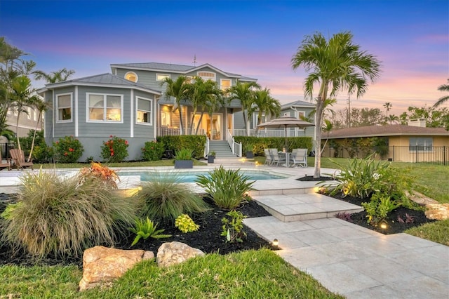 810 Siesta Dr, Sarasota, FL 34242 - view of front of house featuring an outdoor pool and a patio