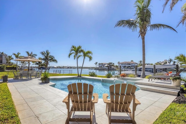 810 Siesta Dr, Sarasota, FL 34242 - outdoor pool featuring a patio area and a water view