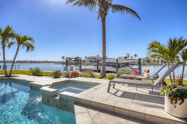 810 Siesta Dr, Sarasota, FL 34242 - swimming pool featuring a water view, an in-ground hot tub, and a patio area