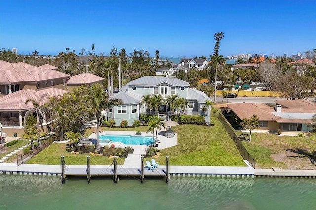 810 Siesta Dr, Sarasota, FL 34242 - back of property with a water view, a residential view, and a lawn