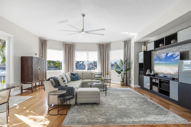 810 Siesta Dr, Sarasota, FL 34242 - living room featuring light wood-style flooring and a ceiling fan
