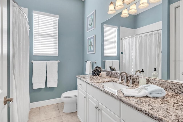 810 Siesta Dr, Sarasota, FL 34242 - bathroom featuring vanity, toilet, a chandelier, baseboards, and tile patterned flooring