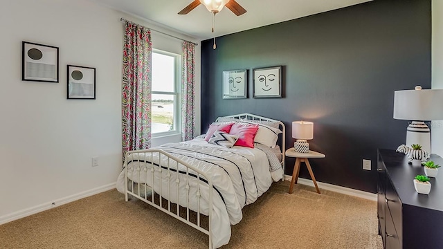 bedroom featuring a ceiling fan, baseboards, and carpet floors