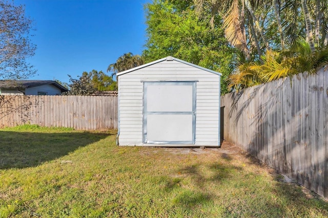 view of shed featuring a fenced backyard