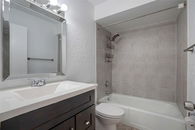 full bath featuring shower / bath combination, toilet, vanity, and a textured wall