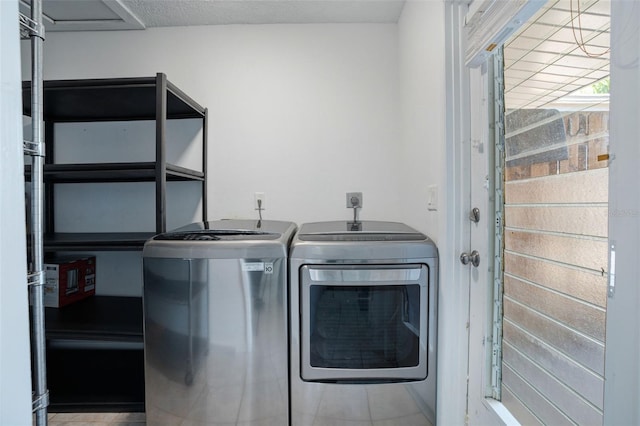 clothes washing area with laundry area and washing machine and clothes dryer