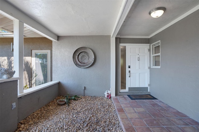 doorway to property with stucco siding