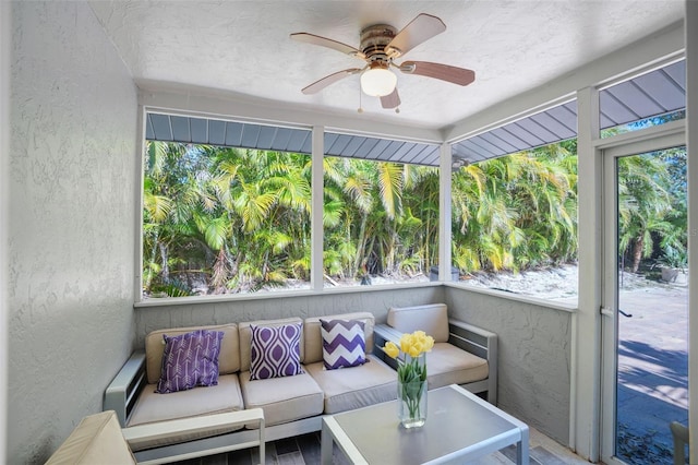 sunroom with a wealth of natural light and ceiling fan