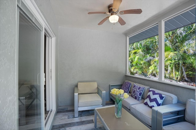 sunroom / solarium with ceiling fan