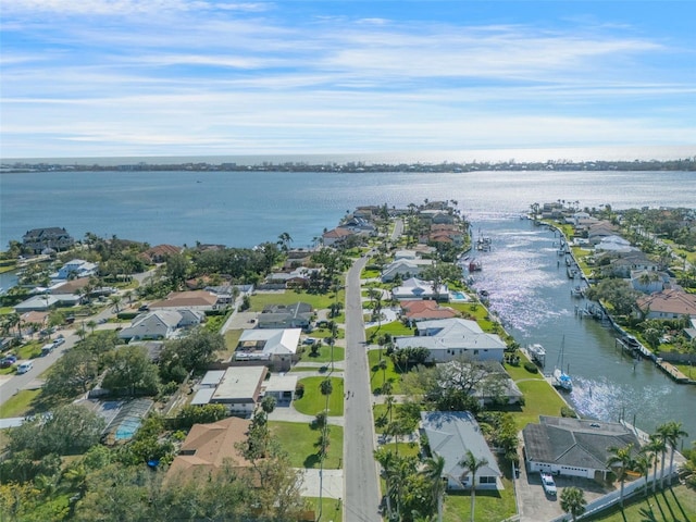 birds eye view of property featuring a residential view and a water view