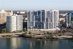 exterior space featuring a view of city and a water view