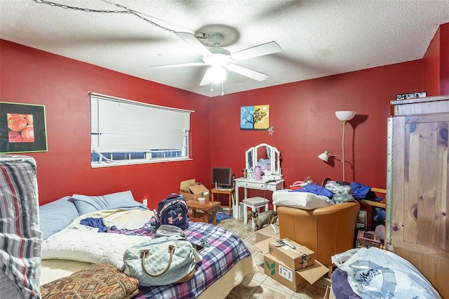 tiled bedroom featuring a textured ceiling and ceiling fan