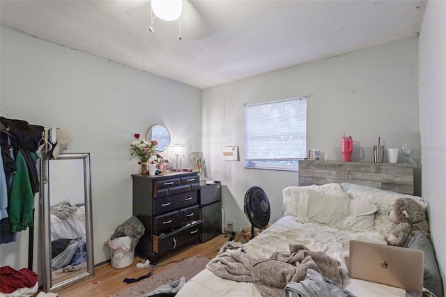 bedroom featuring light wood-type flooring and ceiling fan