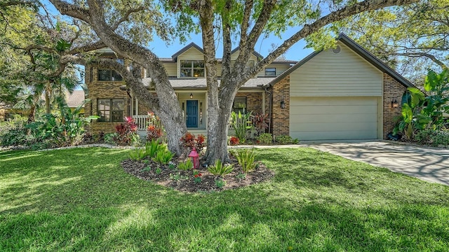 view of front of home with a garage, brick siding, concrete driveway, and a front lawn