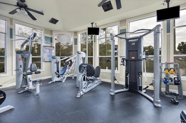 gym with baseboards and ceiling fan