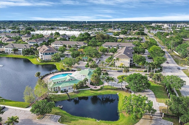 birds eye view of property featuring a residential view and a water view