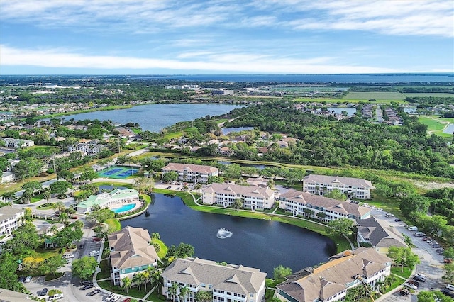 drone / aerial view featuring a residential view and a water view